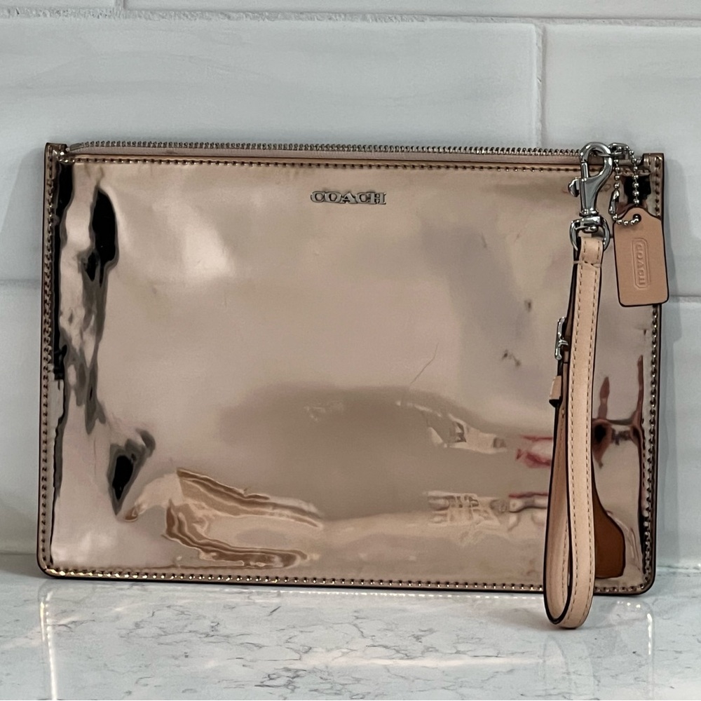 Coach Legacy Rose Gold Metallic Envelope Clutch Model 50292 with wrist strap.
